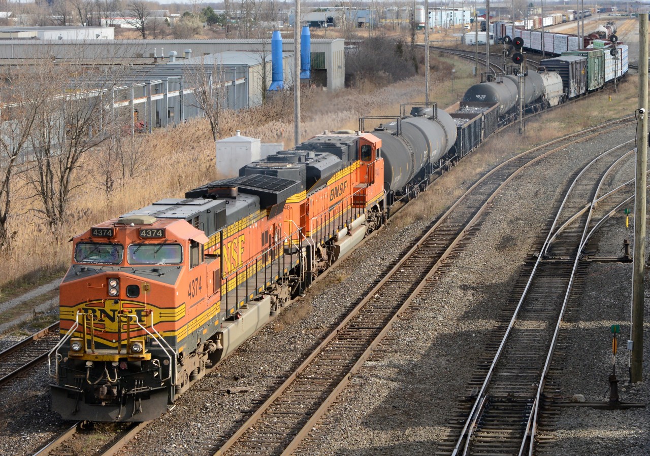 CN train 501 heads for the St. Clair River Tunnel with BNSF4374 and BNSF9148.