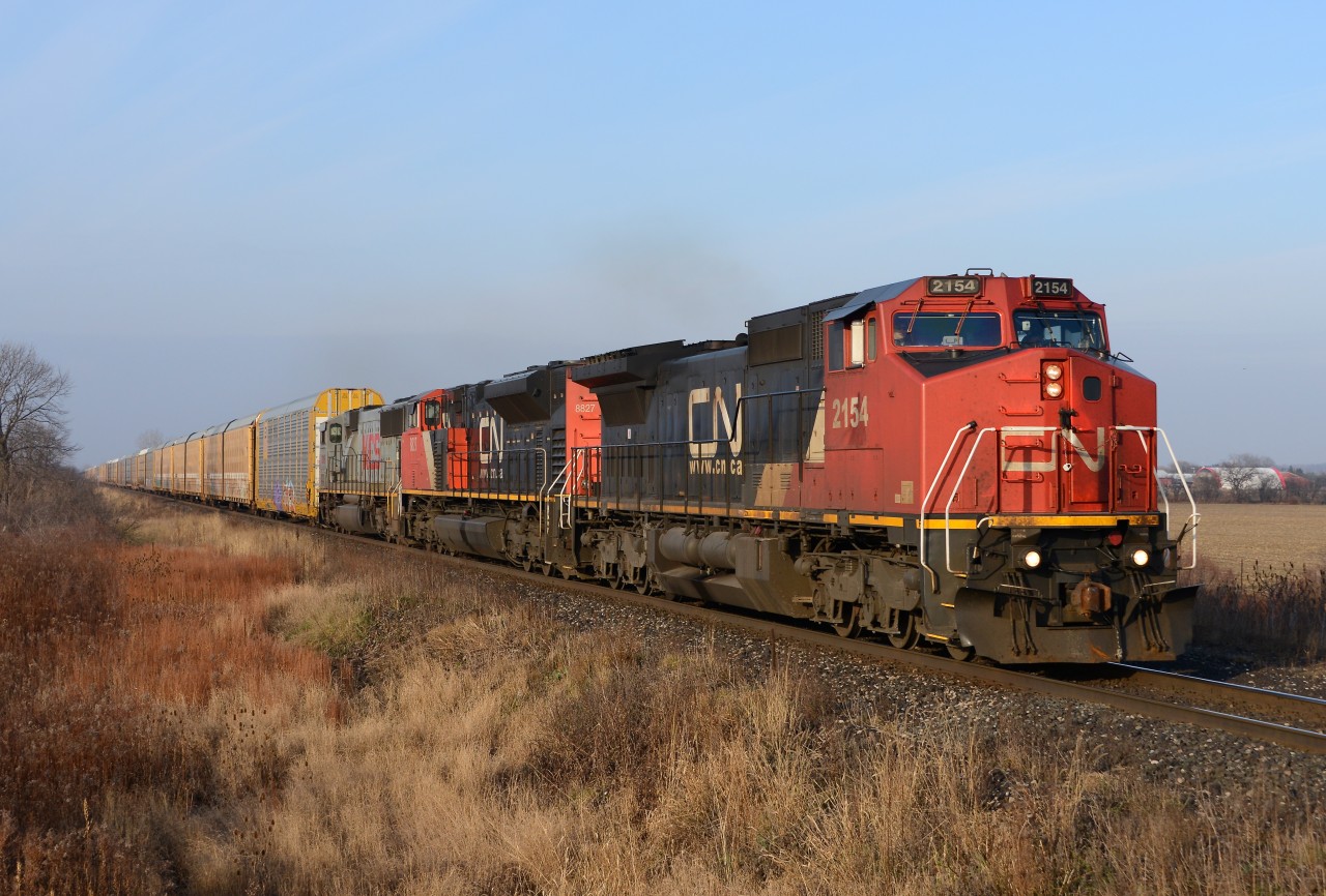 Train 332 crosses Fairweather Road with CN2154, CN8827 and KCS3916.