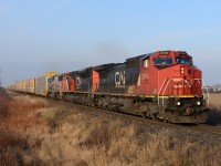 Train 332 crosses Fairweather Road with CN2154, CN8827 and KCS3916.