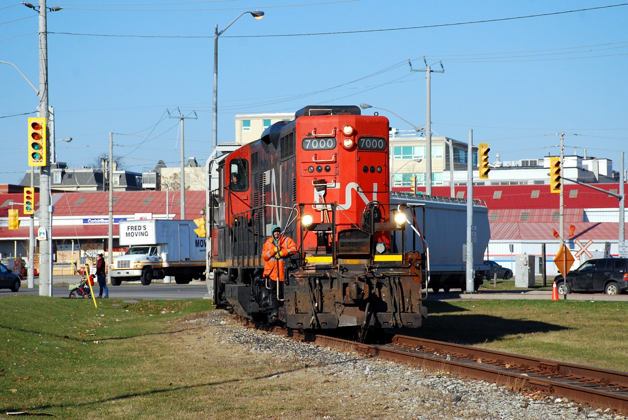 CN 580 crosses Greenwich Street on the way to Ingenia with three cars. It sounds like CN is done serving the Burford Spur on Decemeber 31, with Ingenia purchasing the line and contracting to Southern Ontario Railway to continue service in the new year. A representative from Transport Canada was along for the ride today, I don't know if its related to the change in service provider or not. Also noteworthy is the building with the red roof in the background, which is Harold & Goetz TIM-BR Mart. Many years ago they had their own siding off the original alignment of the Burford Subdivision and received building materials by rail.