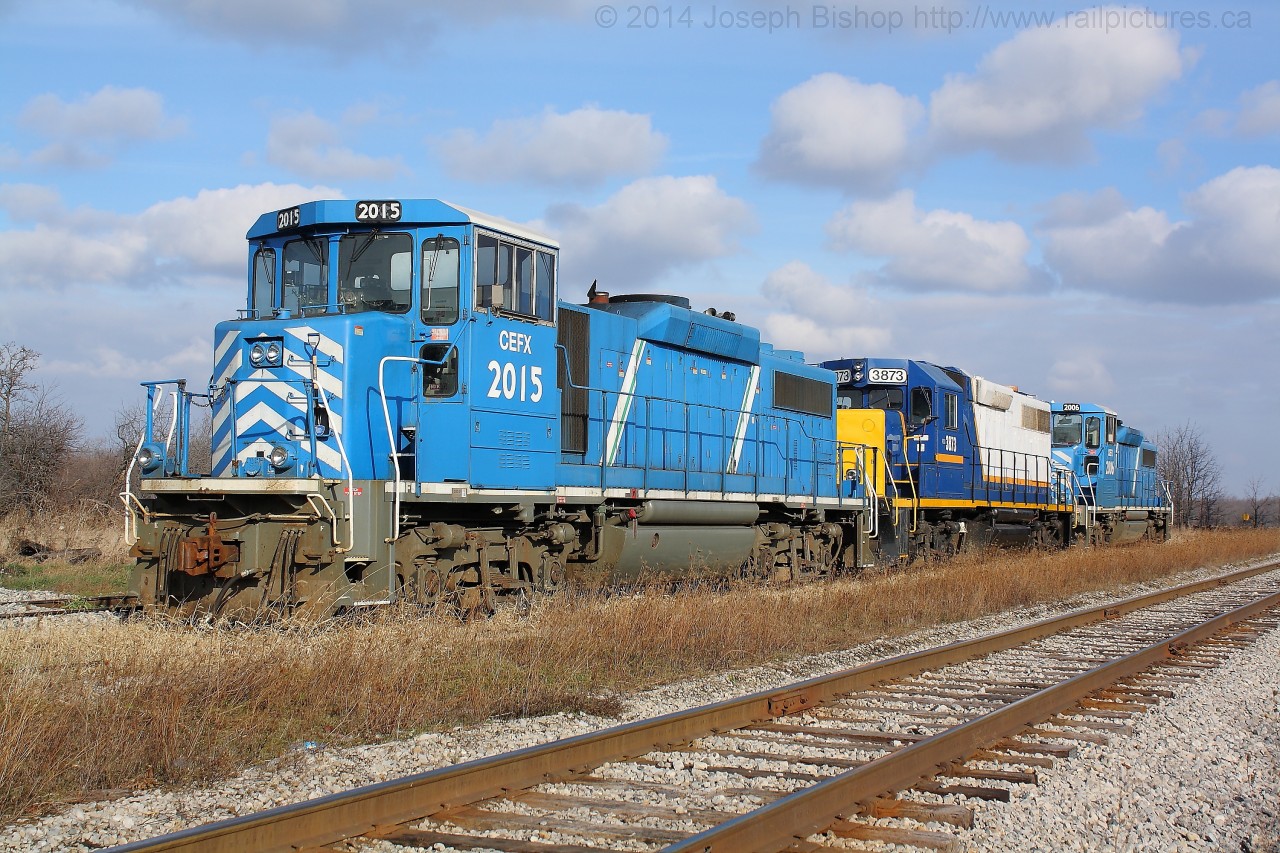 Back on May 22, Rob Smith and myself were standing on the station platform at Brantford shooting a late running SOR 597 with CEFX 2019, CEFX 2015 and RLK 4057.  The day before we had found out that the SOR would be receiving a pair of SD40-2's to replace the GP20D's.  Rob referred to his shot as "The Beginning of the end" of the GP20D's.   My picture depicts "the end" of the GP20D's on the SOR.  On my way to Garnet to photograph the new SD40-2's I stopped by Hagersville with a hunch I would find some kind of power there.  CEFX 2015, RLK 3873 and CEFX 2006 were tied up in the yard at Hagersville.  They were waiting for a crew to come on duty to run them to Hamilton before being turned over to CN for return to CEFX.  So the end of the GP20D's has come...time to shoot some SD40-2's!
