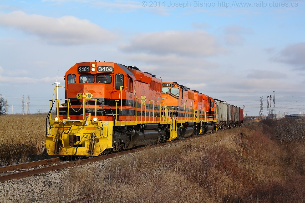 SOR 595 with RLHH 3404 leading the way approached Nanticoke Road with four covered hoppers from Caledonia that will be part of their train for Paris tonight.  There was not a speck of blue to be found on the Hagersville Sub today with QGRY 2301 working train 593 and 3404, 3049 and 3403 on 595.