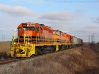 SOR 595 with RLHH 3404 leading the way approaching Nanticoke Road with four covered hoppers from Caledonia that will be part of their train for Paris tonight.  There was not a speck of blue to be found on the Hagersville Sub today with QGRY 2301 working train 593 and 3404, 3049 and 3403 on 595.  