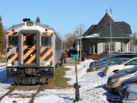 York Durham Heritage Railway's cab-car 101 sits at the Uxbridge station, awaiting its next run at 13:00 on a beautiful sunny Saturday morning. There is an ALCO RS-11 on the tail.