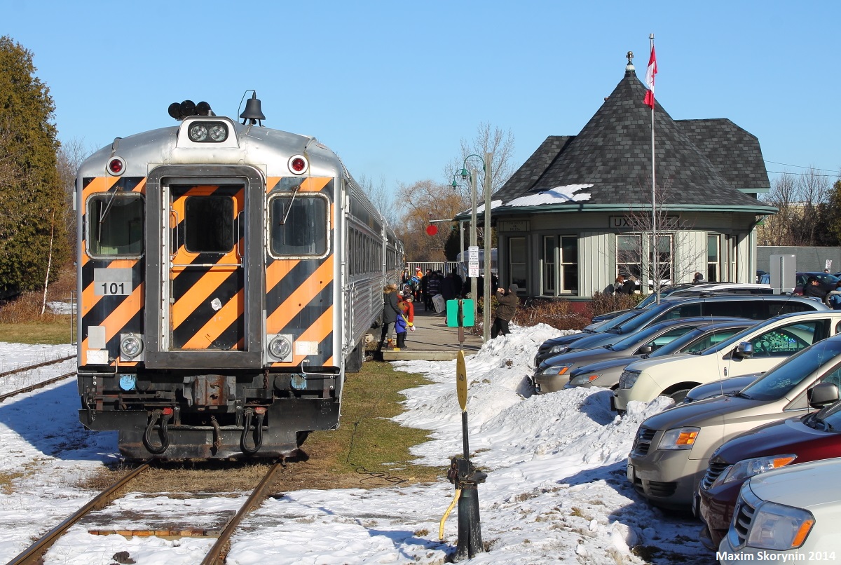 York Durham Heritage Railway's cab-car 101 sits at the Uxbridge station, awaiting its next run at 13:00 on a beautiful sunny Saturday morning. There is an ALCO RS-11 on the tail.