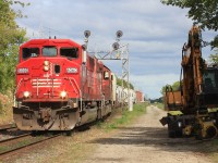 Triclops Soo 6060 and CP 6017 bring this small cut of cars to Lambton yard.