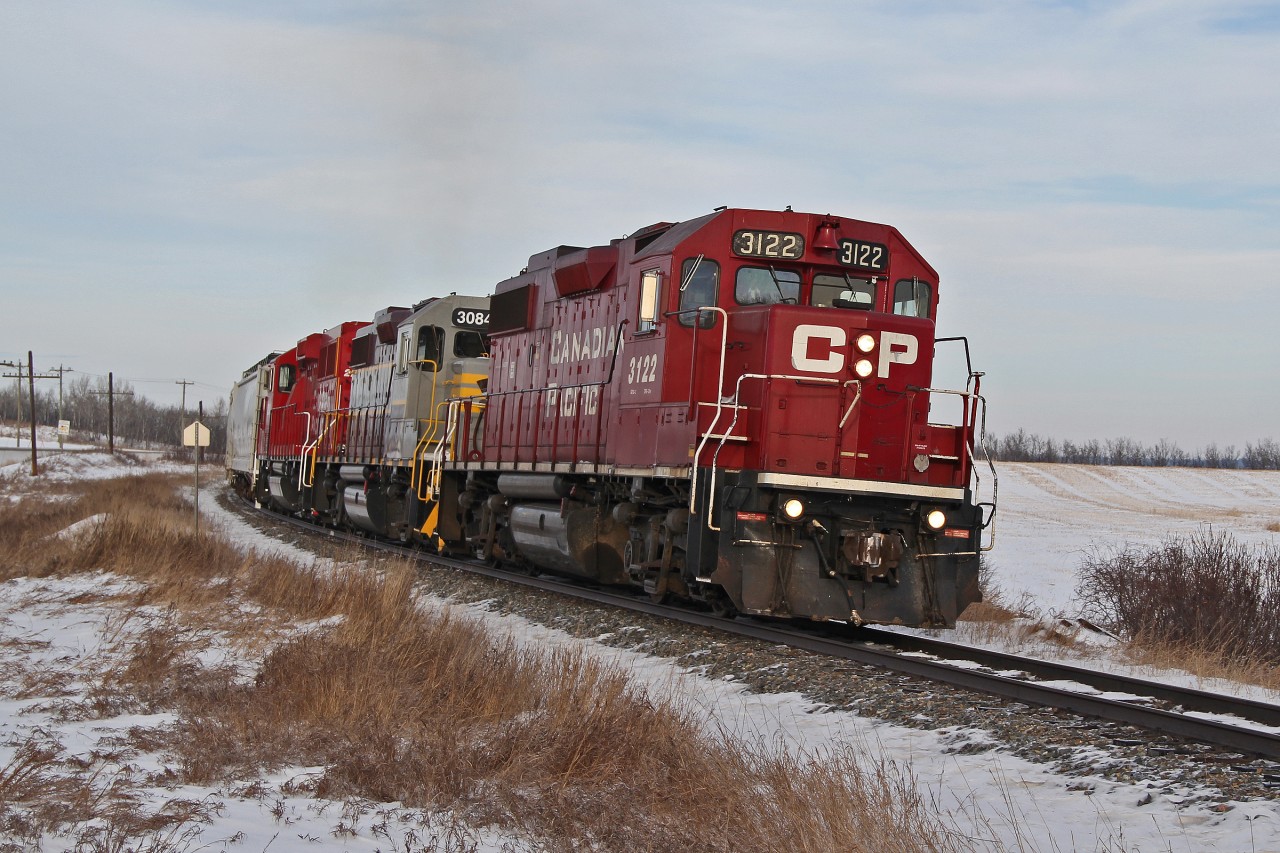 GP 38-2's CP 3122, 3084 in tuscan and grey heritage paint and GP20C-ECO 2232 head south from Lacombe towards Red Deer.