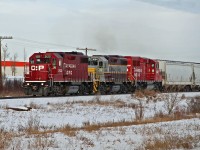 GP 38-2's CP 3122, 3084 in tuscan and grey heritage paint and GP20C-ECO 2232 approaching Red Deer.