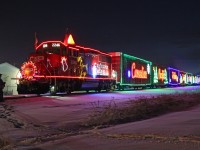 Showing off the Christmas lights to full effect GP20C-ECO CP2246 withh the Holiday Train at Wetaskiwin after sun-set.