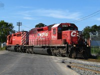 Two different paint schemes, these london built GMD SD40-2 run light power to Toronto yard.