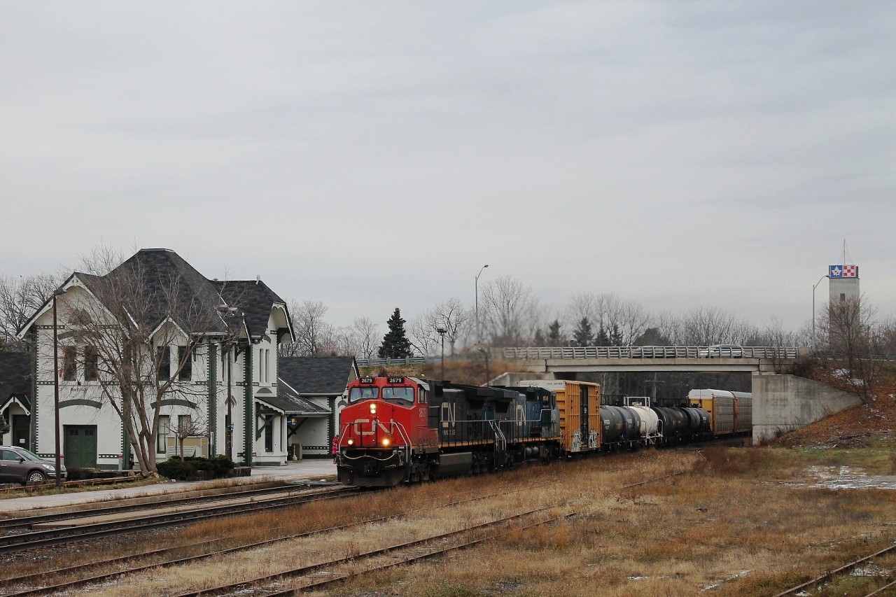 Normally the bright sunshine stops me getting a shot with the station in view. No such trouble today. 2679 and IC Blue 2457 speed up the hill.