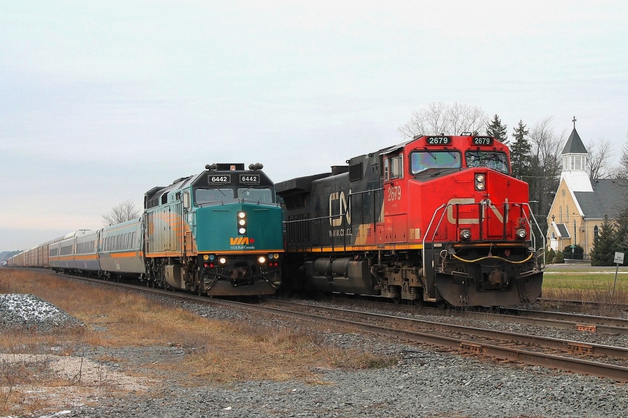 Having seen 382 at Woodstock I took a circuitous route to Princeton via the Galt sub. Imagine my surprise when I found 382 parked just short of the road crossing at Princeton. Apparently the detector at mile 40 had caused the train to be halted whilst the conductor checked the cars. Via 72 speeds past before 382 restarts and has a roll past at the crossing.