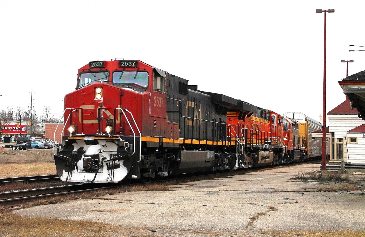 Whilst the rest of Ontario was hit with snow, the only snow at Ingersoll was on the front of the westbound locos. 393 had CN2537, BNSF 7458 & QNSL 311 for power.