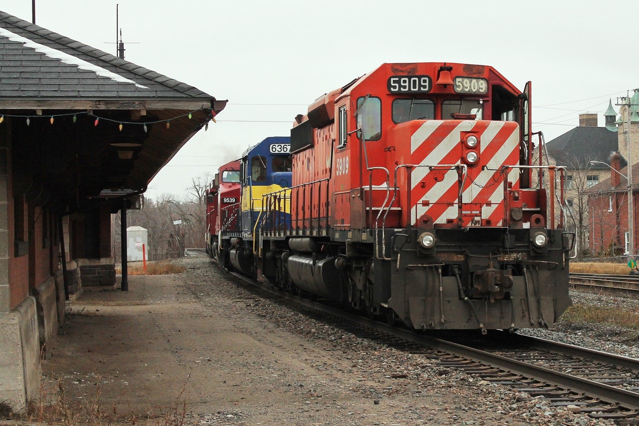 Having delivered autoracks up the Kitchener Sub The four locos head east past the old Galt station to re attach to the train. The train then sped off west.