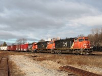 An eastbound mixed freight with a lot of centrebeam cars on a beautiful cold day. CN 5711,5792,7517 lead the train on the south track.