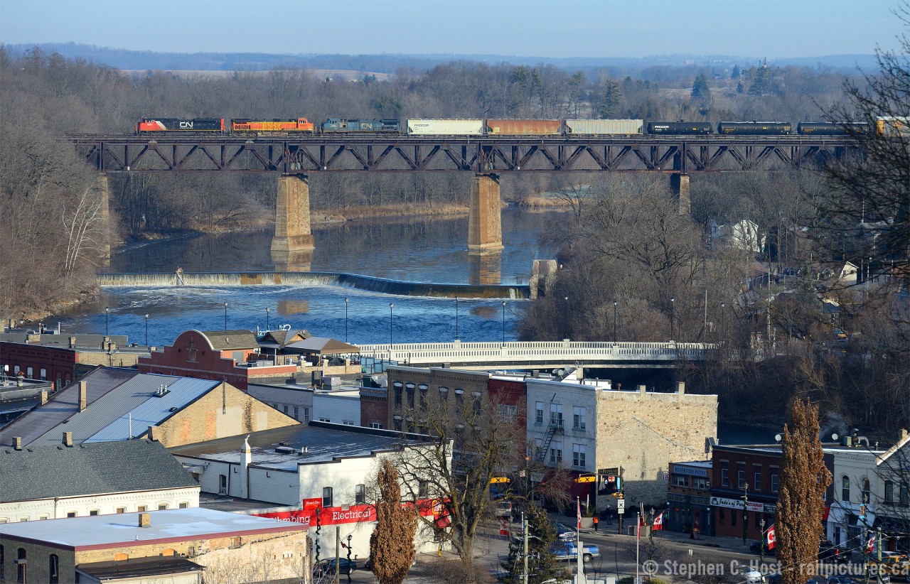 A Westbound (Anyone know the symbol?) crosses the Grand River with a colourful mix of power as the small town of Paris prepares for Christmas.