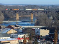 A Westbound (Anyone know the symbol?) crosses the Grand River with a colourful mix of power as the small town of Paris prepares for Christmas.

