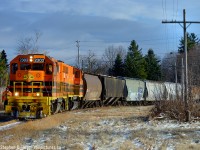 GEXR 516, with 13 cars for Guelph is rounding the curve on the former Fergus subdivision. In 1974, the second car of this train would be sitting on the switch of the Guelph City spur, which ran as a  Belt Line, ending up alongside the CPR to access the mills and industries downtown. These spurs were built by the Great Western Railway system in the 1850's as the Galt and Guelph extensions of the GWR mainline from Lynden Jct but by the 1860's the need to extend a railway from Guelph north to Kinkardine was needed, and the Wellington Grey and Bruce was chartered. In 1871 this cutoff was built - creating the switch described above - to extend the railway north via Palmerston.<br><br>Fast forward 100 years, in 1970 standing here for the day you would see CN RDC's from Toronto heading out of town at 50 MPH along with local and unit Oil Trains for Douglas Point. Local CN Crews were also known to park their engines at the junction on the Belt Line to get Chinese food at the establishment nearby, still in business today. Imagine what the person of the 1870's would have thought of the railway of the future with trackside ready made food, self-propelled passenger cars running 50+ MPH and all that oil in 80 car unit trains.<br><br>Stations and structures were also located at these junctions back in the day, and MOW structures existed at left until the late 1990's - when they were dismantled they were found to be full of speeder parts according to local railway historians who were present for the dismantling.<br><br>Modellers: Notice the different colour of 2303's decal? 3030/3393 use the engines paint for the GW Orange - 2303 appears to be an exception.