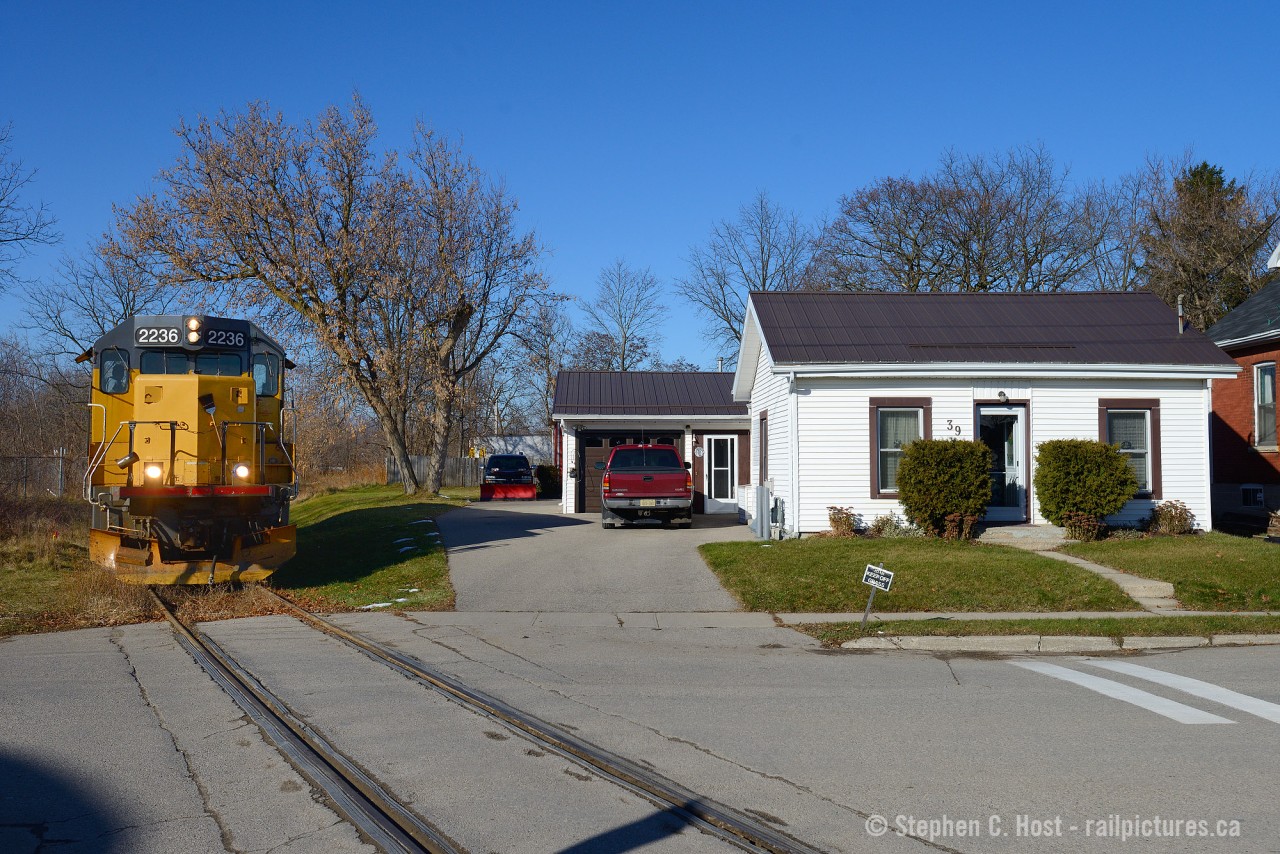 LLPX 2236 has no trouble keeping off the grass as a meeting of General Motors products at 39 Crimea St in Guelph which once formed part of the Fergus subdivision and was a fairly busy mainline. Railways and Houses have close proximity to each other in various locales around the country - and this is no exception. From 1969 to approx 1974 80 car oil trains passed this very spot almost daily on their journey from Montreal, Toronto, Guelph, Palmerston, Southampton and ultimately at the Bruce Nuclear facility at Douglas Point. Passenger trains also passed this spot ending with RDC's in 1970. The home dates to approx 1900. Anyone with photos of these oil or passenger trains up the Bruce Branches?