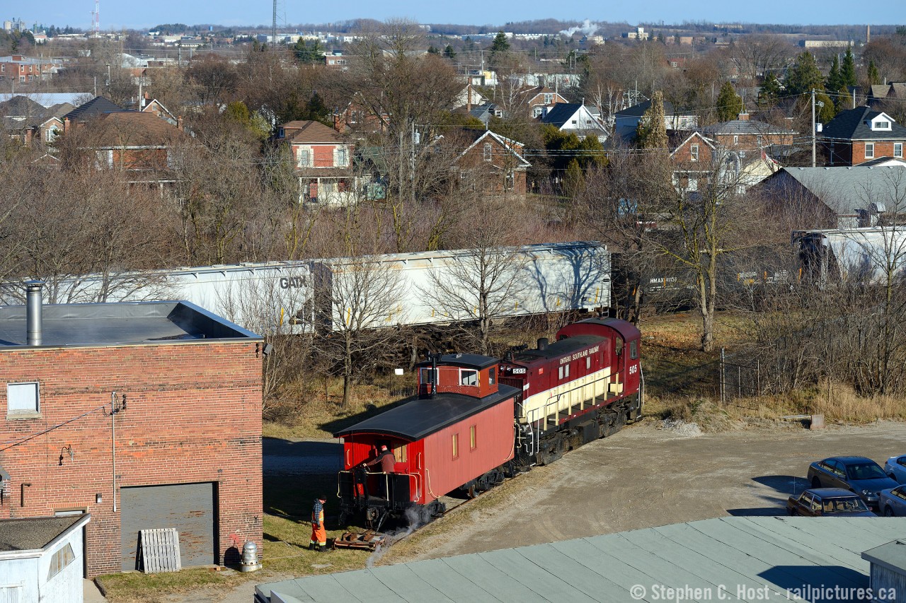A birds eye view as the Guelph Historical Railway Association's former CPR 436994 is getting a lift from Ontario Southland Railway. The spur, for Chemtura- formerly Uniroyal was used by the GHRA since 1998 and today was the last move out of this spur, as Chemtura is moving to new digs and so is the Caboose. Restoraiton of the Caboose has come a long way and you can see the mennonite milled Tongue and Groove which was re-installed fairly recently. A few more finishing touches to go in 2015 by the groups loyal membership will finish the job - to get involved see the club website for more details. Thanks to OSR for their great service and also to the Guelph Junction Railway for permission for the movement.