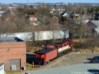 The conductor and brakeman are performing final checks as the <a href=http://www.ghra.ca>Guelph Historical Railway Association's</a> former CPR 436994 is getting a lift from Ontario Southland Railway #505. The spur, for Chemtura- formerly Uniroyal was used with grateful thanks by the GHRA since 1998 and today was the last move out of this spur, as Chemtura is moving to new digs and so is the Caboose. Restoration of the Caboose has come a long way and you can see the Mennonite milled Tongue and Groove which was re-installed fairly recently. A few more finishing touches to go in 2015 by the groups loyal membership will finish the job - to get involved see the club website for more details. Thanks to OSR for their great service and also to the Guelph Junction Railway for permission for the movement.