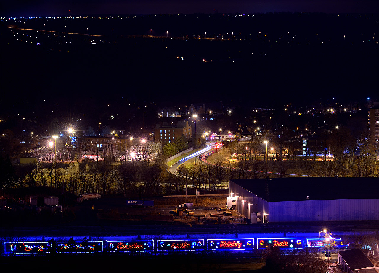 The festivities are over - the Holiday train is parked for the night and the grey cup ended in sorrow for Hamilton fans. While children sleep dreaming of Santa, the adults imbibe with alcohol to sooth wounds after the nights loss to the Stampeders. Yet for some reason I was still out and about photographing the CPR Holiday train at the west end of the former TH&B Aberdeen yard at 11 PM. Why do we do this anyway? When do we get our grey cup? Do we win anything? hahah.