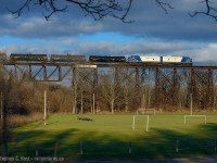 Ontario Southland Railway's latest in-service FP9u 1400 is now in the lead paired to sister unit 1401 as they are passing over what the locals call the Wabash Trestle. Crossing over Athletic Park in St. Thomas, Standing here 40+ years ago you would have seen copious amounts of London built  F7's in Wabash (then Norfolk and Western) Service. It's a real treat to have London built F's on the bridge again - only due to the abandonment of the St. Thomas and Eastern Railway last year is this even possible. OSR now handles CN interchange traffic destined for its own customers and Future Transfer in Tillsonburg, and a result OSR runs to the yard in St. Thomas. Sometime soon CN should decide on the future of the Cayuga sub - rumour is a shortline, Railmark, is interested and working on the deal for early 2015 as reported in local newspapers.<br><br>
Just a few minutes earlier CN 584 cleared the bridge so it was quite busy in St. Thomas this afternoon.