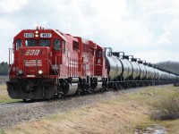 SOO 4420, a GP38-2 with a nicely mismatched set of numberboards and a burned out headlight, leads the returning train from the Rimbey Gas Plant with about 26 cars of liquefied petroleum gas in tow. The second unit is 2235, a GP20C-ECO, the first I'd seen on this line.