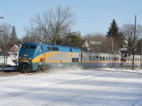 Happy Holidays! VIA 73 heads west with LRC cars with fresh snow on the ground and sunny skies.