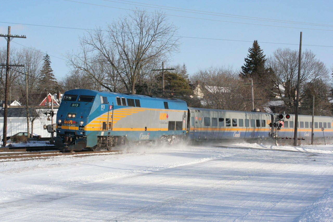 Happy Holidays! VIA 73 heads west with LRC cars with fresh snow on the ground and sunny skies.