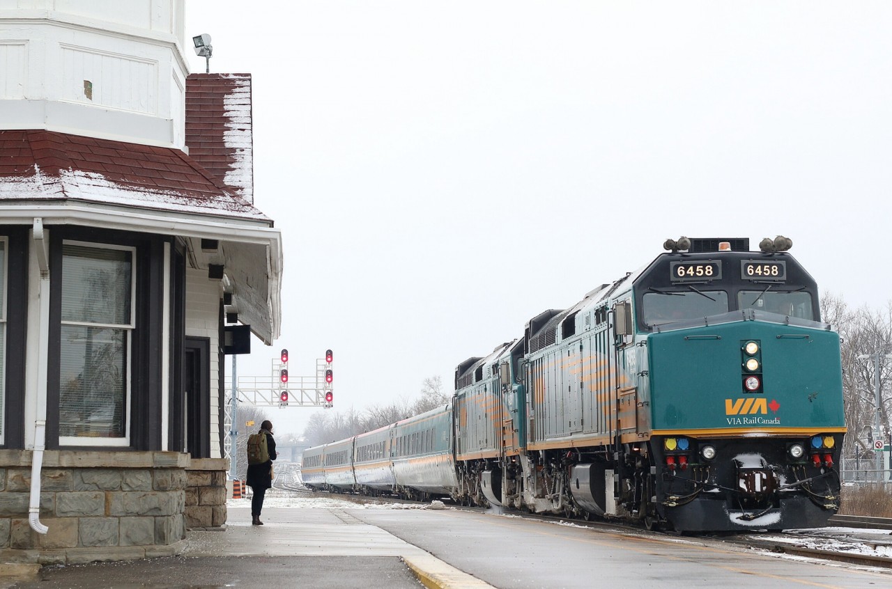 An overpowered train 84 comes to a stop in front of the former CNR Georgetown station, as a lone passenger awaits permission to climb aboard and head for Toronto.