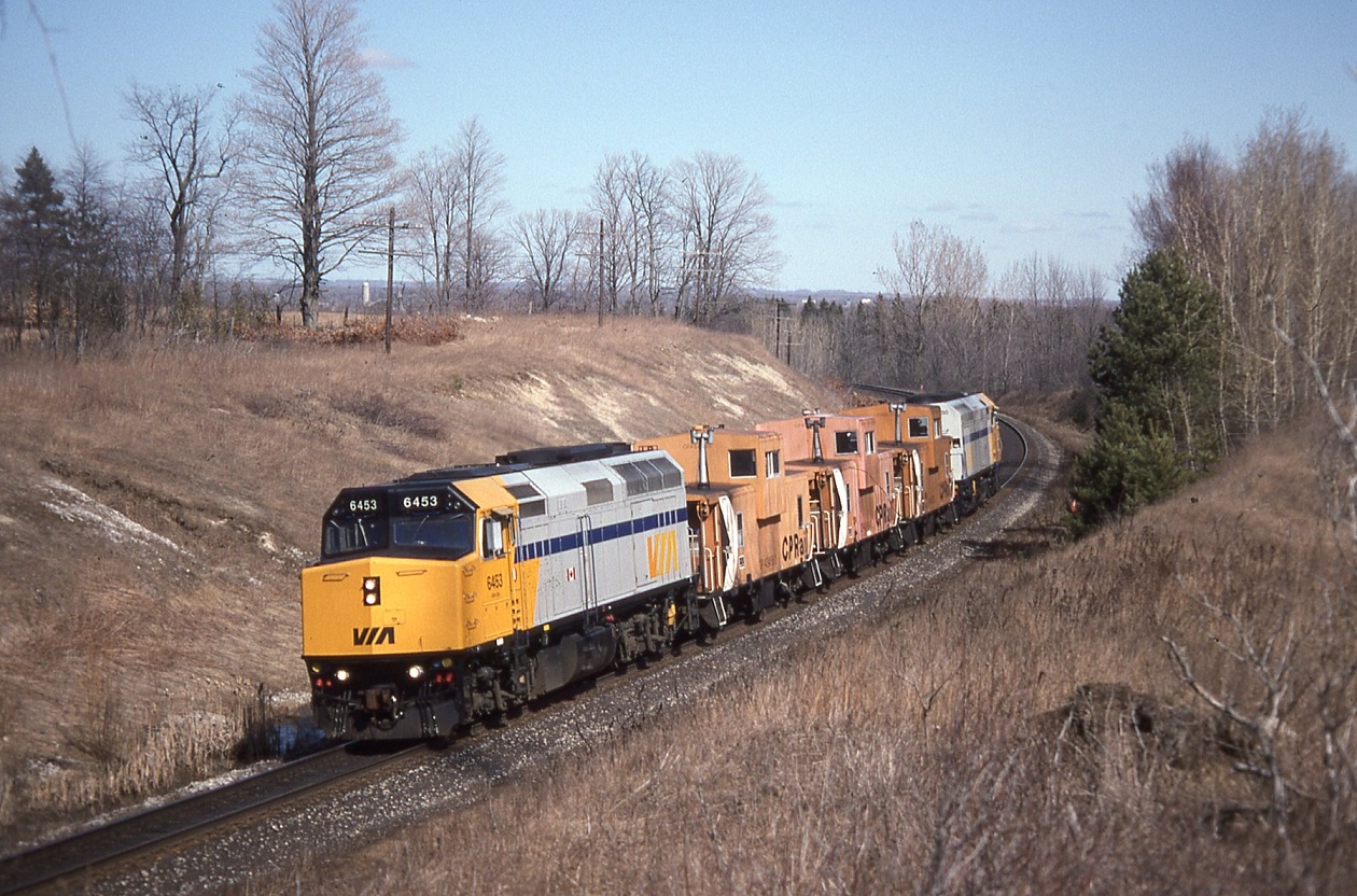 During a strike of CP,s mechanical staff and to avoid picket line delays, replacement workers were shuttled between Oshawa and Agincourt with two Via FP40PH,s and three CP vans. The WB movement shown at Ajax ( Audley )