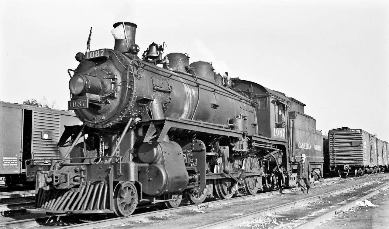 1087 The Way Freight is in from Havelock after making its way along the Peterboro Subdivision doing work here and there.  Crew will layover at Lambton before heading back next day to their home terminal at Havelock.  Like many similar jobs it works 6 days a week in opposite directions with Sunday off. In other words ex Havelock Monday, Wednesday and Friday. Ex Lambton Tuesday, Thursday and Saturday.  D-10 class engines were particularly suitable for this type of work.  The next day 1057 will be dispatched. Both 1057 and 1087 lasted until the end of steam early in 1960. Monday, November 9, 1959.