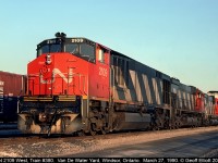 Three "Big 6's", an HR616 #2109, M636, and a C630 round out train #380's consist tonight as they arrive and slowly roll through Van De Water Yard in Windsor, Ontario on March 27, 1990.