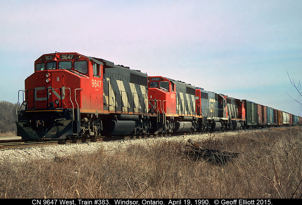 April 19, 1990 and CN 9647 has charge of CN Train #383 as it approaches the "Ice House Curve" on CN's CASO Subdivision.  9647 will be rolling by Windsor South depot shortly as it drops down the grade and into the Detroit River Tunnel to make it's run to the Grand Trunk in Flat Rock, Michigan.
