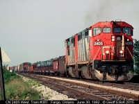 June 30, 1992 and CN 8-40CM #2405 leads a sister on CN Train #381 as it rounds the connection from the CSX Sarnia Subdivision to the CN CASO Sub.  Spent many a day out here, and sadly probably didn't take enough pictures.  If you look careful you can see the Fargo CN Operator in the distance having thrown the switches to line-up the train before it arrived.  The old original CASO westbound main, with it's jointed rail, is looking pretty ratty at this point.