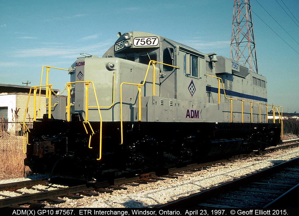 ADM(X) GP10 #7567, ex-Conrail same #, sits in the Essex Terminal/CP Interchange yard in Windsor waiting on the outbound Ojibway Job to lift it.  ADM(X) 7567 will move to ADM in Ojibway and switch cars only for a short time until it is put aside and replaced with a track mobile.  7567 disappeared almost as quickly as it came.  When this unit came into Canada in the week previous it travelled through the Windsor/Detroit Tunnel on NS Train #344, which passed by less than a 1/2 mile from here.  As NS and CP did not interchange in Windsor any longer at this point train 344 had to take this unit all the way to Welland, Ontario where it was Interchanged to the CP.  From there CP took it up to Guelph Jct., and the back west to Windsor to eventually be interchanged by the CP to the ETR.  Talk about taking the scenic route!!!!