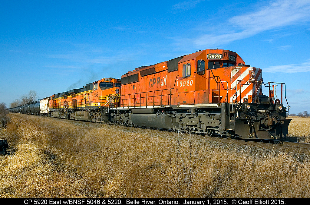 Happy New Year....  Well it's been a while since I've been able to get out and shoot anything on New Year's Day, but a quick trip to Timmy's this morning helped me yield this eastbound ethanol train that was making a meet in Belle River, Ontario.  Old soldier CP 5920 is on the point with BNSF GE's 5046 & 5220 helping out as they get their train rolling again east of Belle River after meeting a 147 just minutes earlier.  Doesn't feel like January with no snow on the ground but the light is choice!!!