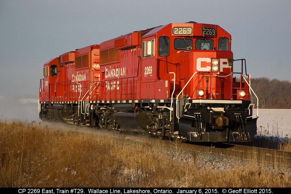 CP GP20C-ECO's #2269 and 2258 kick up some light snow as they head eastbound as a light power move after having delivered 16 "overhead" cars from London Yard to Windsor.  This move is becoming more common lately with the "Chatham Way Freight" being utilized to move these overhead cars and seems to be happening at least once a week.  The Windsor Sub will be quiet after 2269 passes as T-29 is the only train on the Subdivision and there are no other trains ordered until well after lunch.