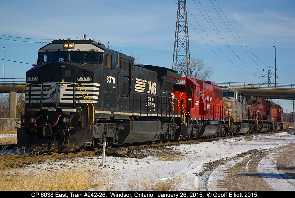 Well, you can't always get what you want.  CP train #242-26 came over the Border into Windsor with NS 8378 leading CP 6222, KCS 4596, and CP 8711 for power.  Well, CP crew wanted a CP lead unit, and by the time I was able to get to Dougall Ave 242-26 had cutoff their train.  They wyed the power @ Walkerville, but problems with both CP 6222 and 8711 forced them to put a tried and true CP SD40-2 #6038 on the point for the train to head east.  In this photo, which is a 'cheater', 6038 is backing the power for 242 back onto it's train after getting a 564 permit to proceed past the red signal.  So, this is basically what the train used to look like....  :-)