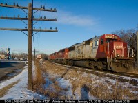 SOO LINE SD60 #6027 leads CP train #T-27 out of Windsor Yard on a beautiful January morning.  To fill out the trio today we have a CP SD40-2 and rebuilt ex-SOO SD60, all working hard to pull the lone empty bulkhead flat of a train!!  6027 will head out to Walkerville and wye the train, then afterwards make a lift of cars, before going through the VACIS X-ray and heading to the U.S.