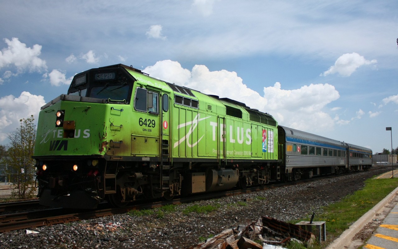 Out doing a little bit of railfanning, and this VIA F40PH-2 pulls into the Georgetown station, decorated for Telus Communications.