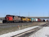 Looking back, I'm not sure what was uglier: an SD40-2W in its decades-old factory paint with peeling black and primer brown showing through, or a relatively newer UP SD70M that, during a visit to LA, probably sat in one place too long. Nevertheless, better than a pair of GE's! CN 5267 and UP 5184 howl through Bramalea GO Station on #399 as it puts in its afternoon appearance, not long after departing MacMillan Yard in Vaughan.