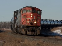 SD60F #5515 teams up with an ex BC Rail C44-9W to haul unit oil train U704 east on the Wainwright Sub