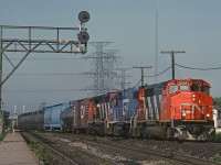 CN 332 heads on to the Halton Sub at Burlington West. The trailing GTW unit was relatively rare in Ontario in 1992.