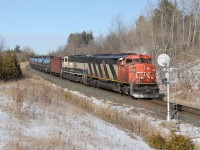 CN U711 glides down the grade at Mile 30 on the CN Halton Sub with CN 5554 and BNSF 9767.