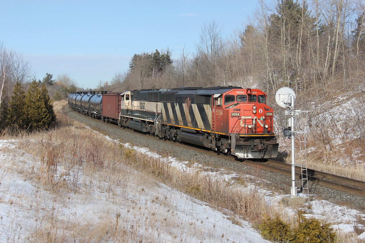 CN U711 glides down the grade at Mile 30 on the CN Halton Sub with CN 5554 and BNSF 9767.