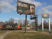 "Get a taste of the Dark". Huh. Did I buy into Tim Horton's marketing once again? Yes. Was it worth it? No! But interestingly, it adds flare to the shot, and the CN 7000 switcher on this day's CN 580 is "dark." Got to love how these CN GP9s in this paint scheme are still around into 2015. This day was the last day of 2014 and no snow on the ground; not too happy about that I'll be honest, especially being that I just returned to Canada from a city in China at the same latitude as Atlanta which doesn't really see snow.