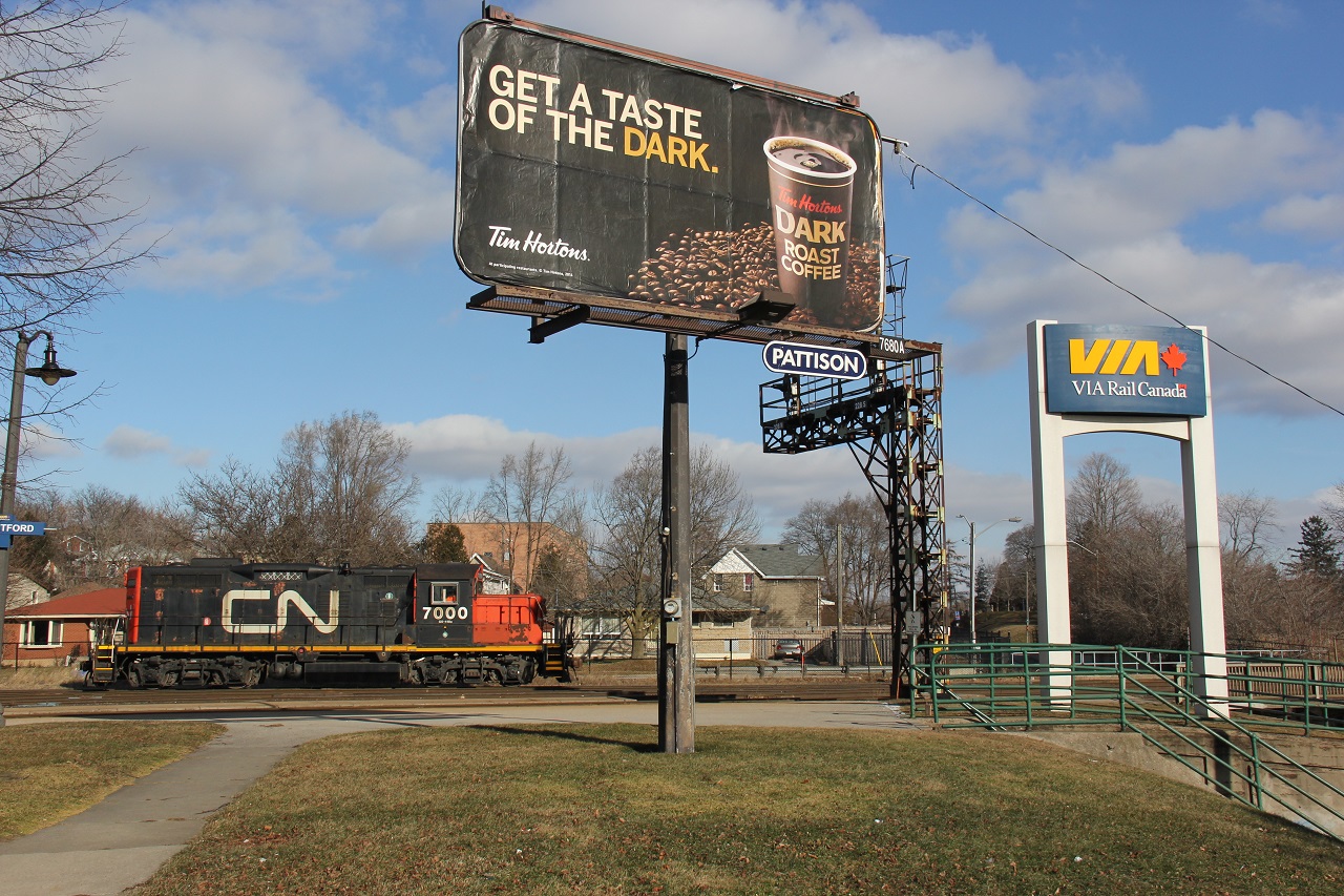 "Get a taste of the Dark". Huh. Did I buy into Tim Horton's marketing once again? Yes. Was it worth it? No! But interestingly, it adds flare to the shot, and the CN 7000 switcher on this day's CN 580 is "dark." Got to love how these CN GP9s in this paint scheme are still around into 2015. This day was the last day of 2014 and no snow on the ground; not too happy about that I'll be honest, especially being that I just returned to Canada from a city in China at the same latitude as Atlanta which doesn't really see snow.