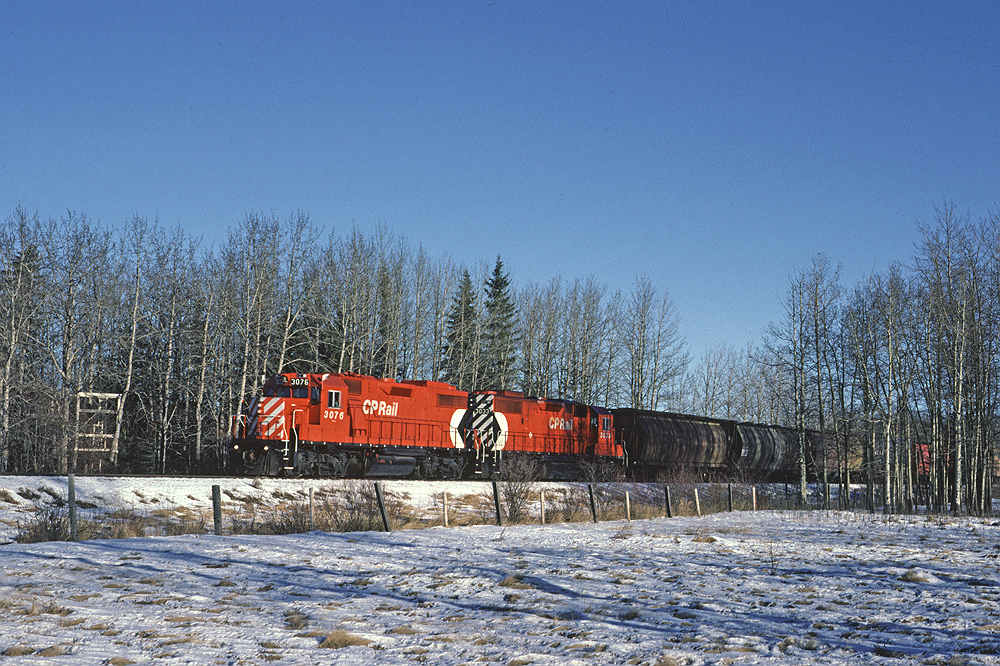 CP GP38-2 3076 leads the Breton Turn west. The Breton Turn originated at South Edmonton and ran as far west as needed on the Breton Sub. The Breton Sub left the Edmonton - Calgary mainline at Leduc.
